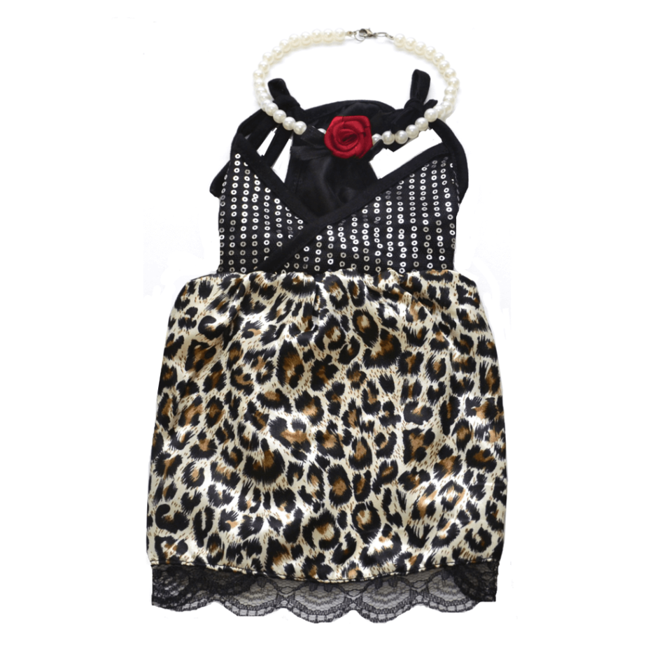 Leopard print dress with black top and pearl necklace on a white background