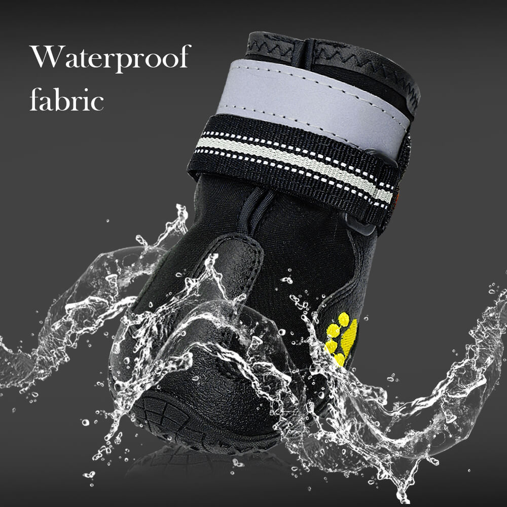 Black dog boot with reflective strip on a dark background with water splashes