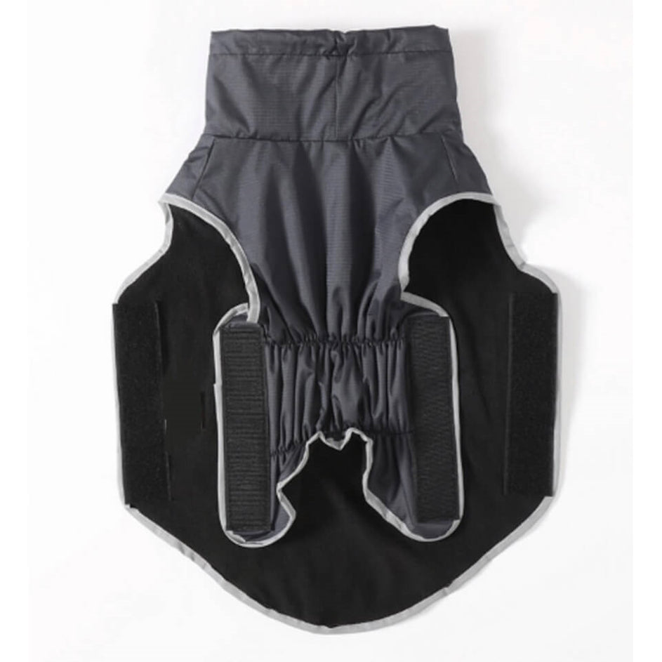 Black and gray dog coat with reflective trim on a white background
