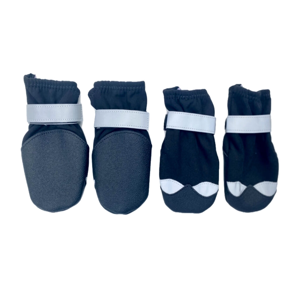 Set of four navy blue pet boots with white accents on a white background
