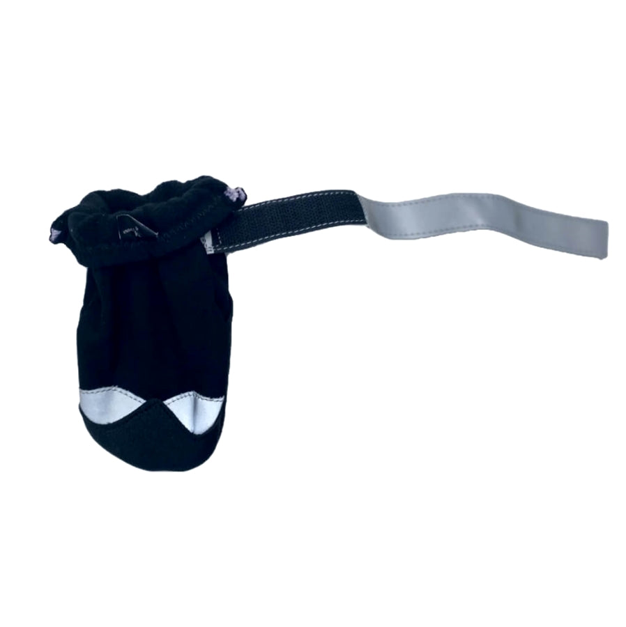 Black dog muzzle with a strap on a white background