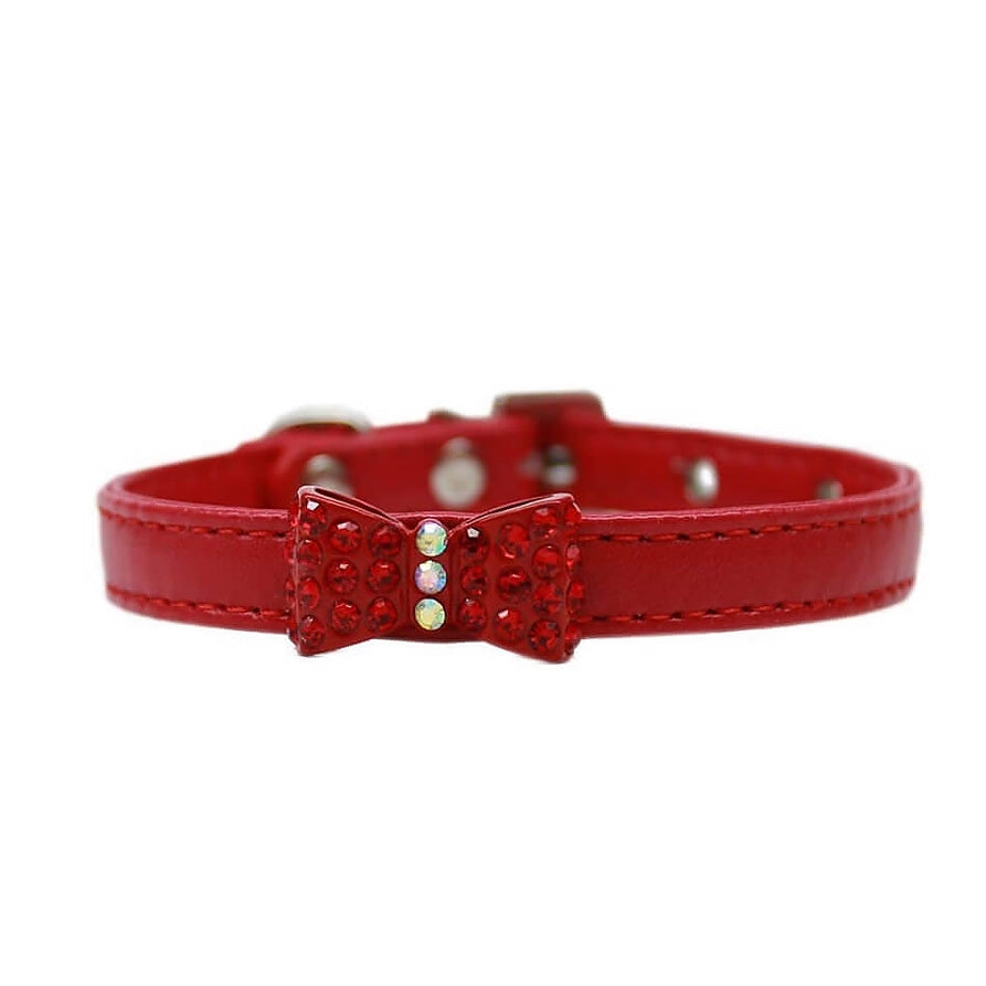 Red dog collar with a decorative bow on a white background