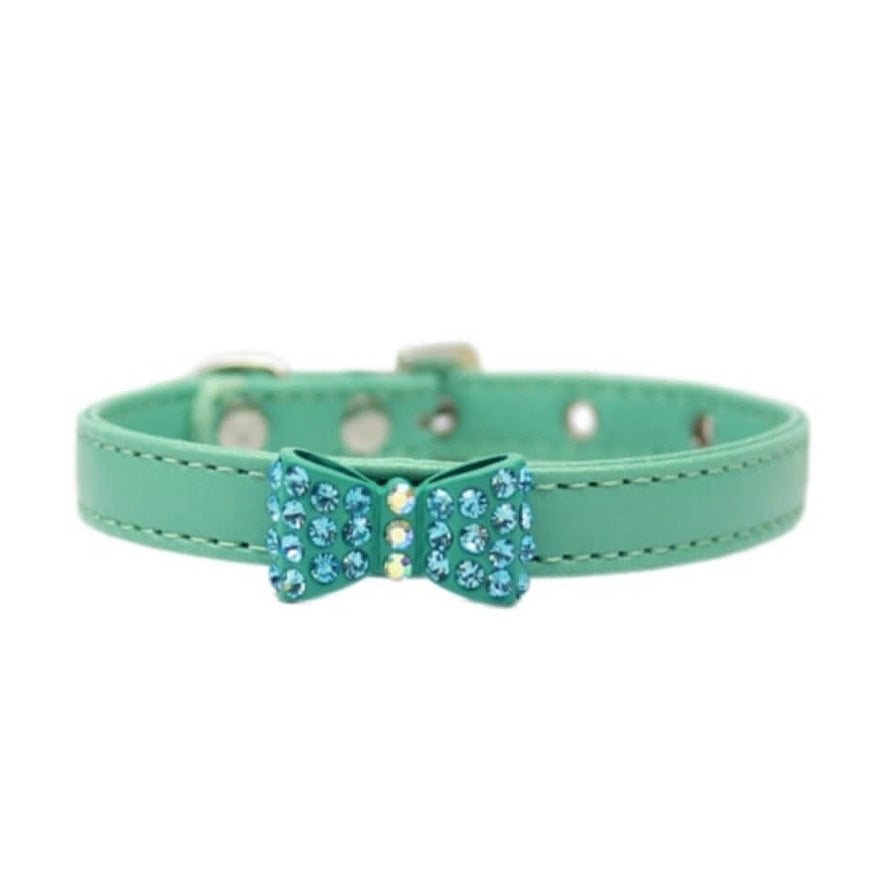 Green cat collar with a blue bow and crystals on a white background