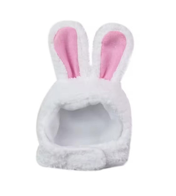 White pet bed with pink bunny ears on a white background