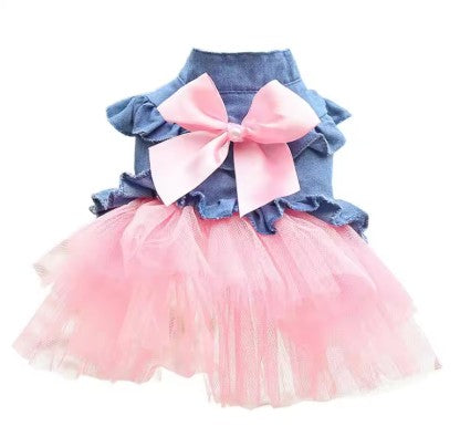 Dog dress with denim top and pink tutu skirt on a white background