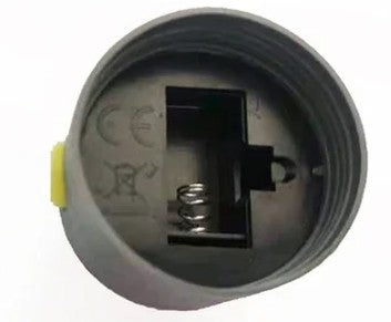 Close-up of a mechanical component with a spring inside on a white background