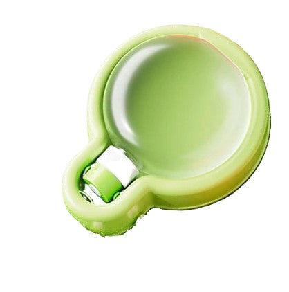 Green plastic scoop on a white background